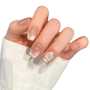 Short square cat-eye press-on nails with 3D floral accents and shimmering silver details