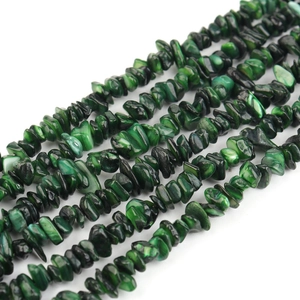 Macro shot of natural green shell gravel beads for DIY jewelry making accessories