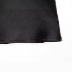 Women's black lace camisole top with silky satin texture and precision stitching