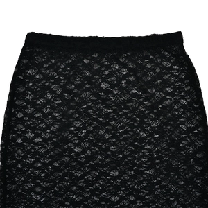 Close-up of intricate black lace texture and waistband detailing on a sheer tiered skirt