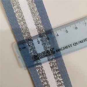 Macro shot of a 3.8cm wide striped woven bag strap with metallic thread and ruler