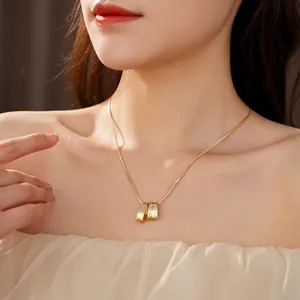 Irregular brushed circle pendant necklace with zircon stones on a gold snake chain