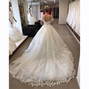 Elegant white lace mermaid wedding dress with long train and off-shoulder V-neckline