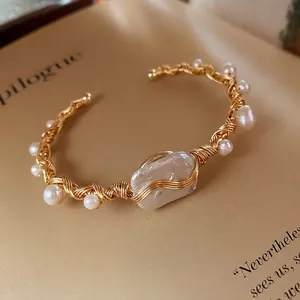 Baroque pearl wrap cuff bracelet with gold wire woven design and irregular main stone