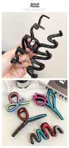 Macro detail of tulip flower shark clips with multi-color acrylic patterns and strong springs