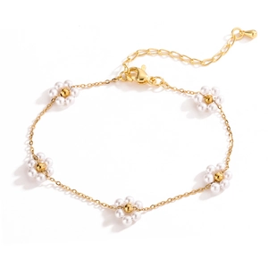 Elegant gold chain bracelet featuring five pearl daisy flower charms and adjustable clasp