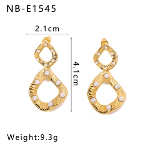 Detailed view of gold twisted bow earrings with white pearl inlay and size specifications