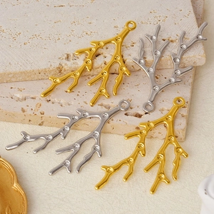Detailed view of 304 stainless steel coral branch charms in gold and silver finishes