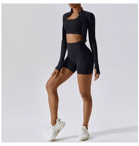 Detailed view of black three-piece sports set featuring a zipper jacket and high waist shorts