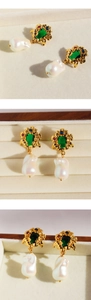 Detailed macro view of vintage Baroque emerald earrings with gold vines and pearls