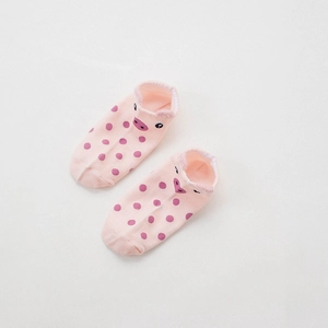 Detail of pink cotton low cut socks with polka dots and 3D cartoon pig face design