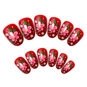 Elegant red floral press-on nails with white dots and hand-painted flower designs