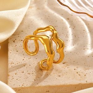 Minimalist double layer wavy open ring in gold finish on neutral textured background