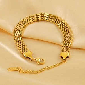 18K gold plated stainless steel braided chain bracelet on a silk background