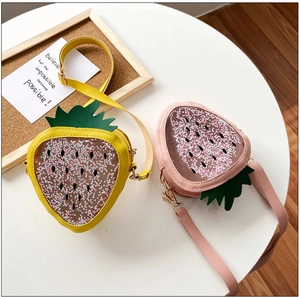Detail of cute strawberry bags with star sequins and transparent glitter window design
