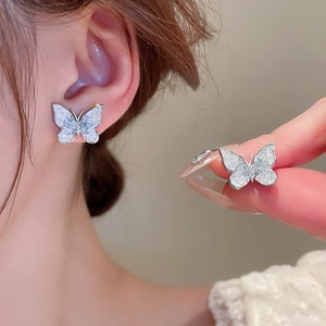 Elegant white butterfly stud earrings with pearl luster and silver metal frame for women