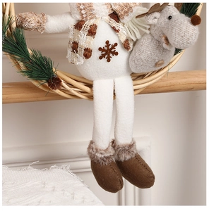 Detail of Christmas wooden wreath with plush snowman, knitted deer and pine cones