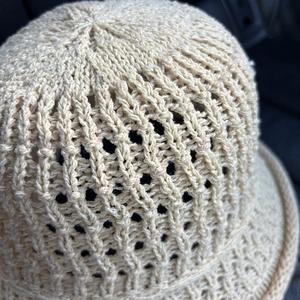 Beige hollow knit bucket hat for women with breathable openwork and summer sun protection