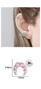 Detailed macro view showing a sparkling zircon-encrusted crescent moon cartilage earring