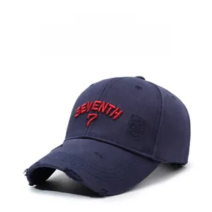 Detail of vintage navy baseball cap featuring 3D red embroidery and distressed torn fabric