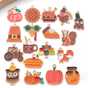 Detailed set of colorful enamel Thanksgiving charms including pumpkin and turkey motifs