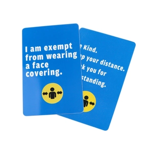 Blue plastic ID card detail showing text I am exempt from wearing a face covering