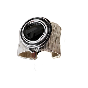 Multilayer wound silver metal cuff bracelet with faceted oval black onyx gemstone