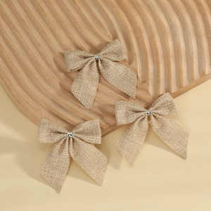 Three natural khaki burlap bows for Christmas tree decoration and DIY gift wrapping
