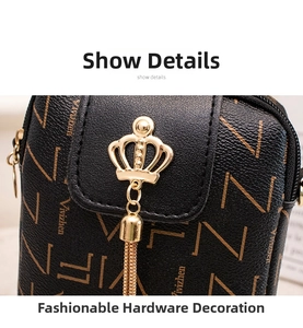 Close-up of golden crown hardware and metallic tassels on printed PU leather phone bag