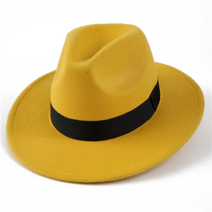 Detail of a bright yellow wool fedora hat with a classic black grosgrain ribbon band
