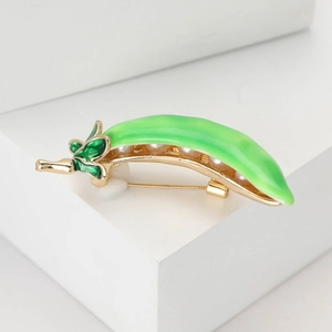 Elegant green enamel pea pod brooch with white pearls on a gold-plated metal base