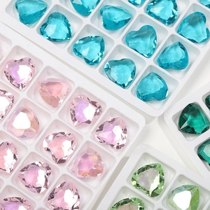 Macro view of multi-colored heart-shaped faceted crystals for jewelry and DIY crafts