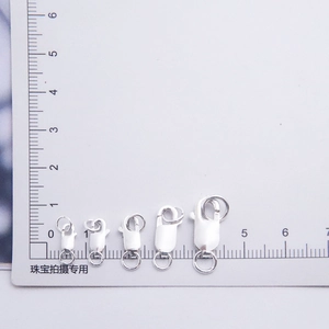 Macro shot showing five sizes of 925 sterling silver spring clasps for jewelry making