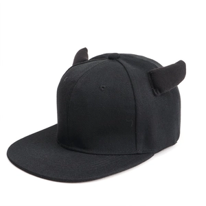 Close-up of black snapback hat featuring unique 3D devil horns on a minimalist crown