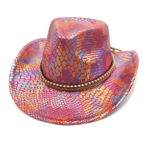Detail of metallic snakeskin texture and bead trim on a colorful Western cowboy hat