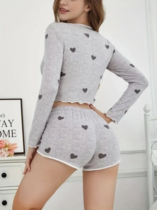 Detail of grey heart print knit loungewear set featuring white lettuce edge trim on back