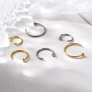 Titanium C-shaped nose rings set in silver and gold colors with various sizes