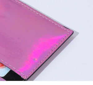 Close-up of pink iridescent PU card holder showing precise stitching and smooth laser texture