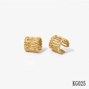 Close-up of golden multi-layered hollow geometric stripe ear cuff earrings