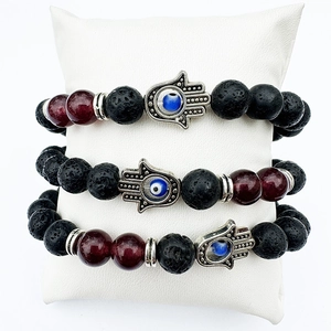 Three-piece black lava rock and red bead bracelet set with Hamsa hand and evil eye charms