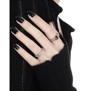 Irregular S925 sterling silver ring with bubble texture and brown gemstone on hand