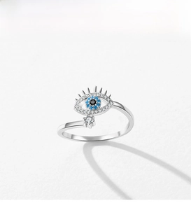 Close-up of S925 sterling silver evil eye ring with blue zircons and eyelash details