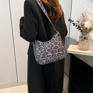 Vintage leopard print crescent shoulder bag for women with gold hardware accents