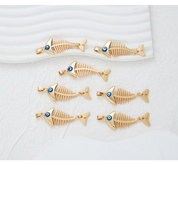 Detailed close-up of six gold-plated alloy fishbone charms with blue evil eye beads