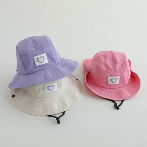 Three colors of quick-dry sun hats with heart patches and adjustable windproof cords
