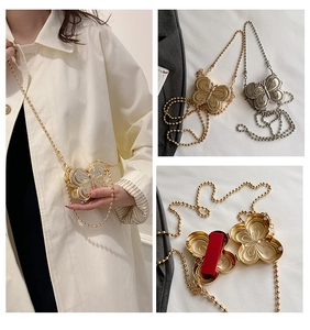 Detailed views of mini butterfly metal purse in gold and silver with chain strap