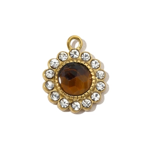 Detail of sunflower pendant with brown natural stone and sparkling white crystals