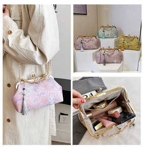 Detail of embroidered brocade shell bags with metal clasps and elegant tassel charms