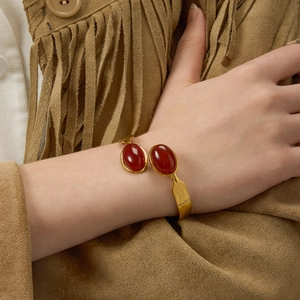 Vintage gold-plated titanium steel bracelet with oval red-brown agate stones for women