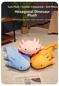 Close-up of soft plush axolotl toys in pink blue and yellow on cozy home rug